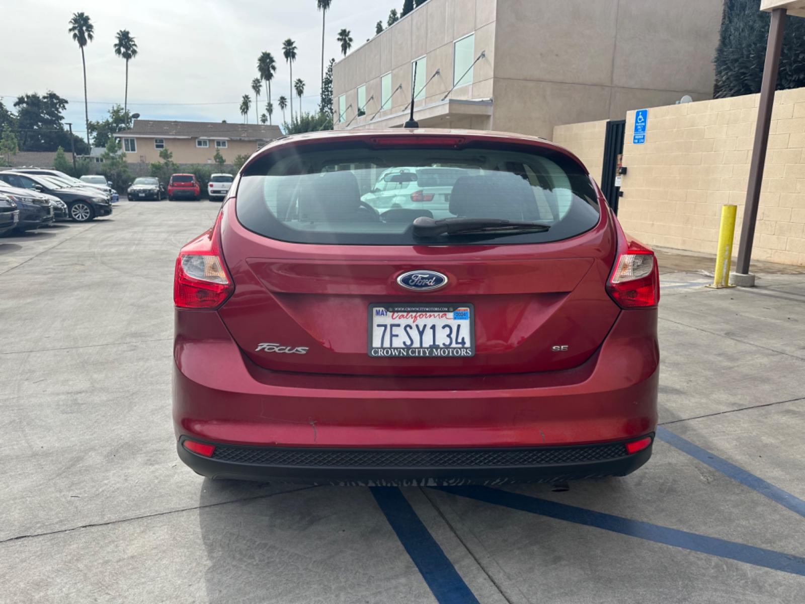 2014 RED /Gray Ford Focus Cloth (1FADP3K24EL) with an 4 Cylinders engine, Automatic transmission, located at 30 S. Berkeley Avenue, Pasadena, CA, 91107, (626) 248-7567, 34.145447, -118.109398 - Good Value! Good MPG! - Photo #3